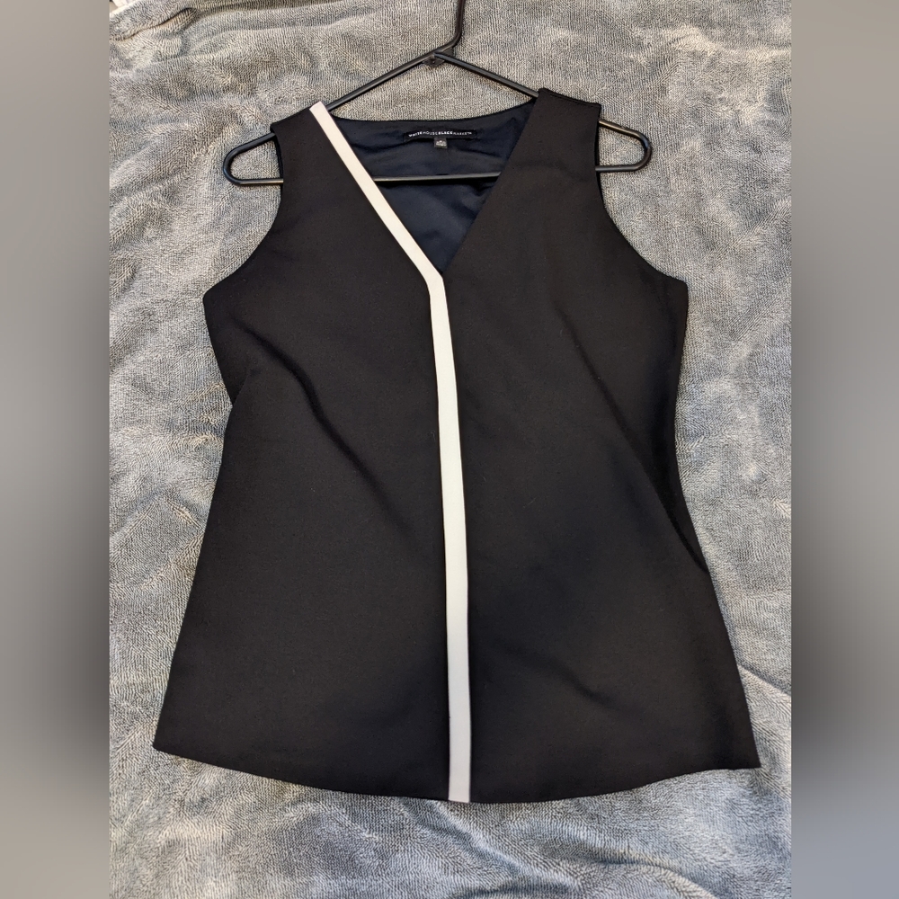 Professional black blouse with white accent